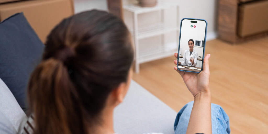 Patient having a video consultation with an Irish-registered online doctor on a laptop at home